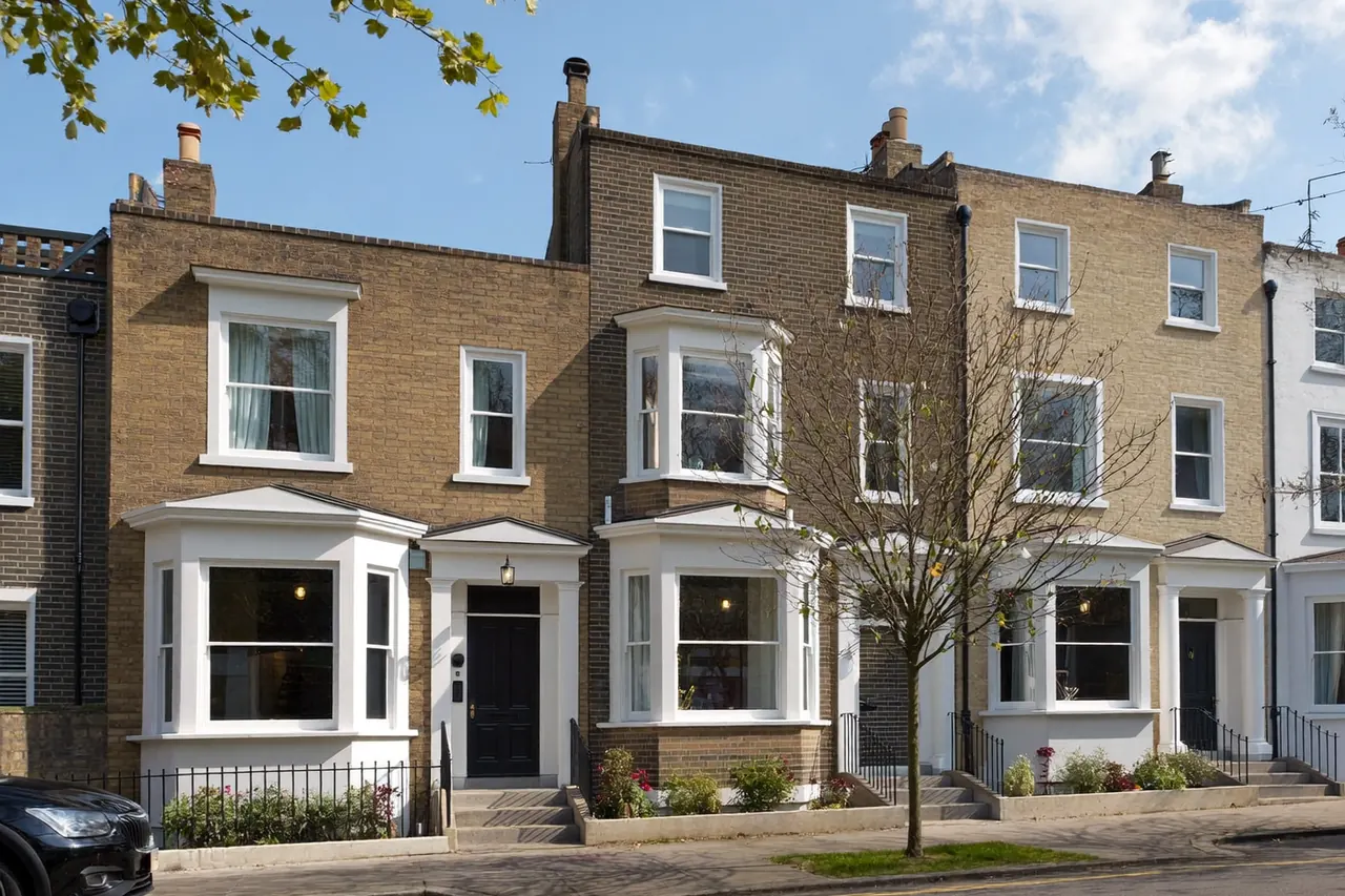 The exterior of a house showing multiple windows to count