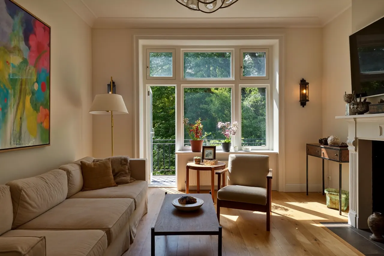 A large bay window filling a living room with natural light