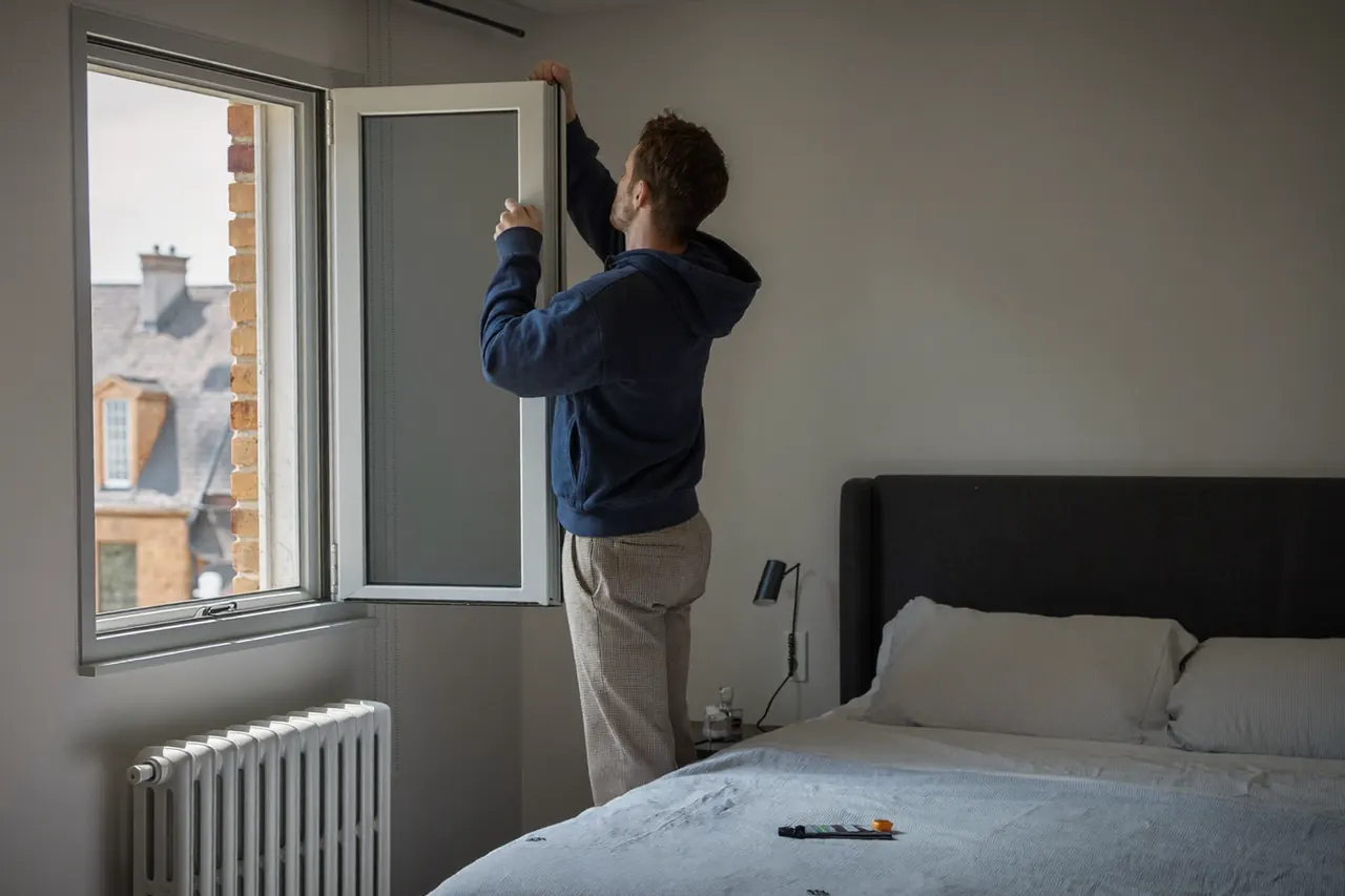 A bright, calm bedroom with a newly fitted window