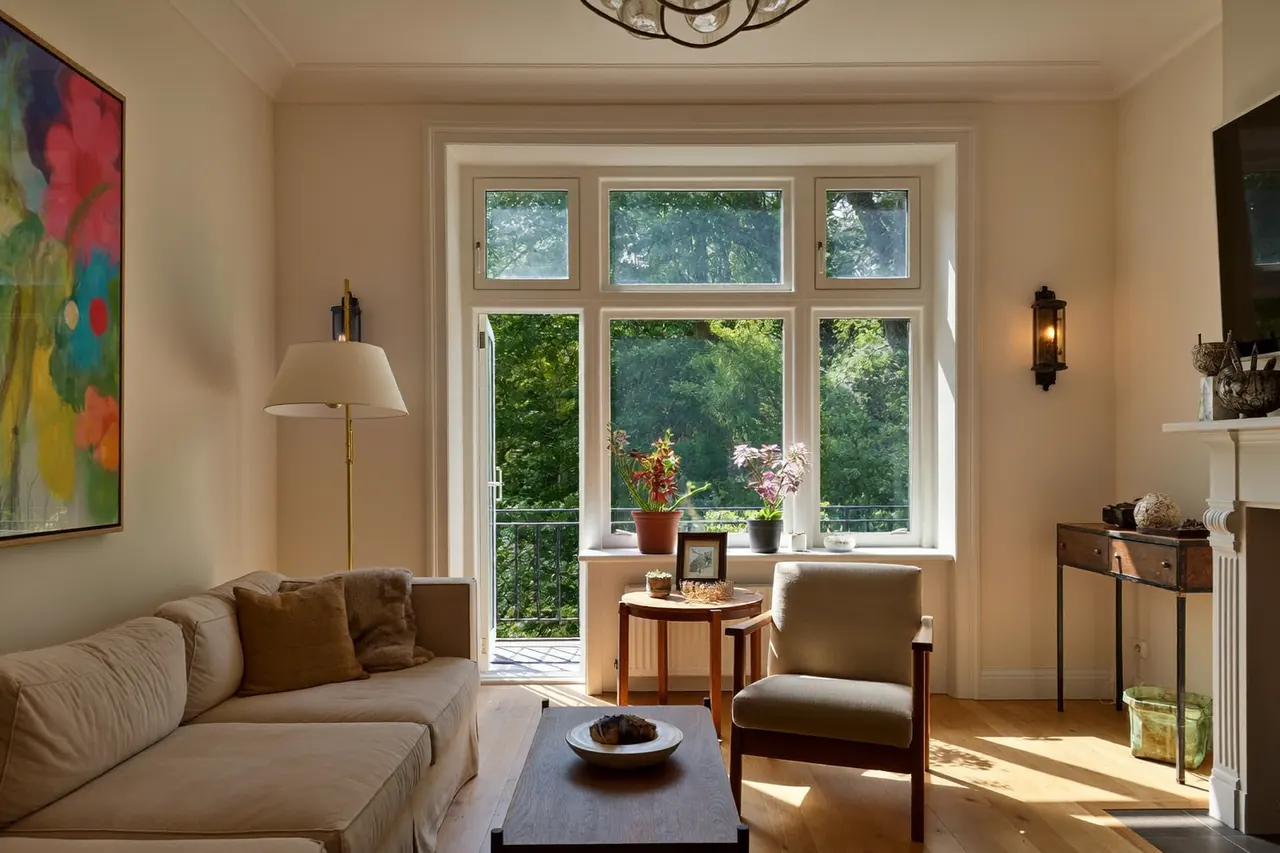 A newly installed window brightening a single refurbished room